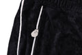 A BATHING APE BATHING APE LOGO VELVET LOOSE FIT PANTS